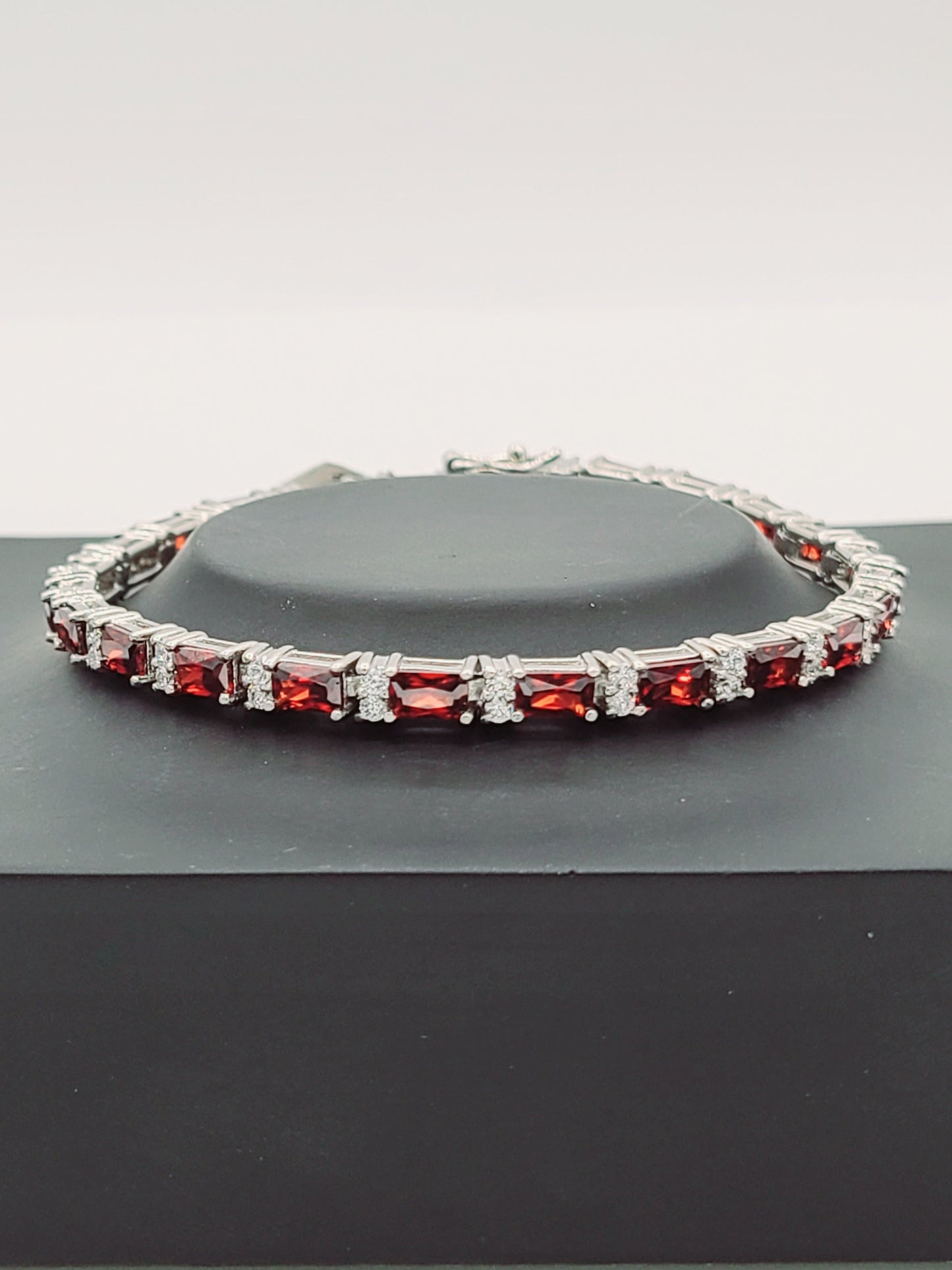 Rhodium Sterling Silver Bracelet with Cubic Zirconia and Synthetic Garnet 7"